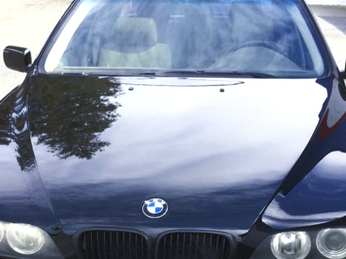 Black BMW with fresh paint job at Earl Scheib of Concord